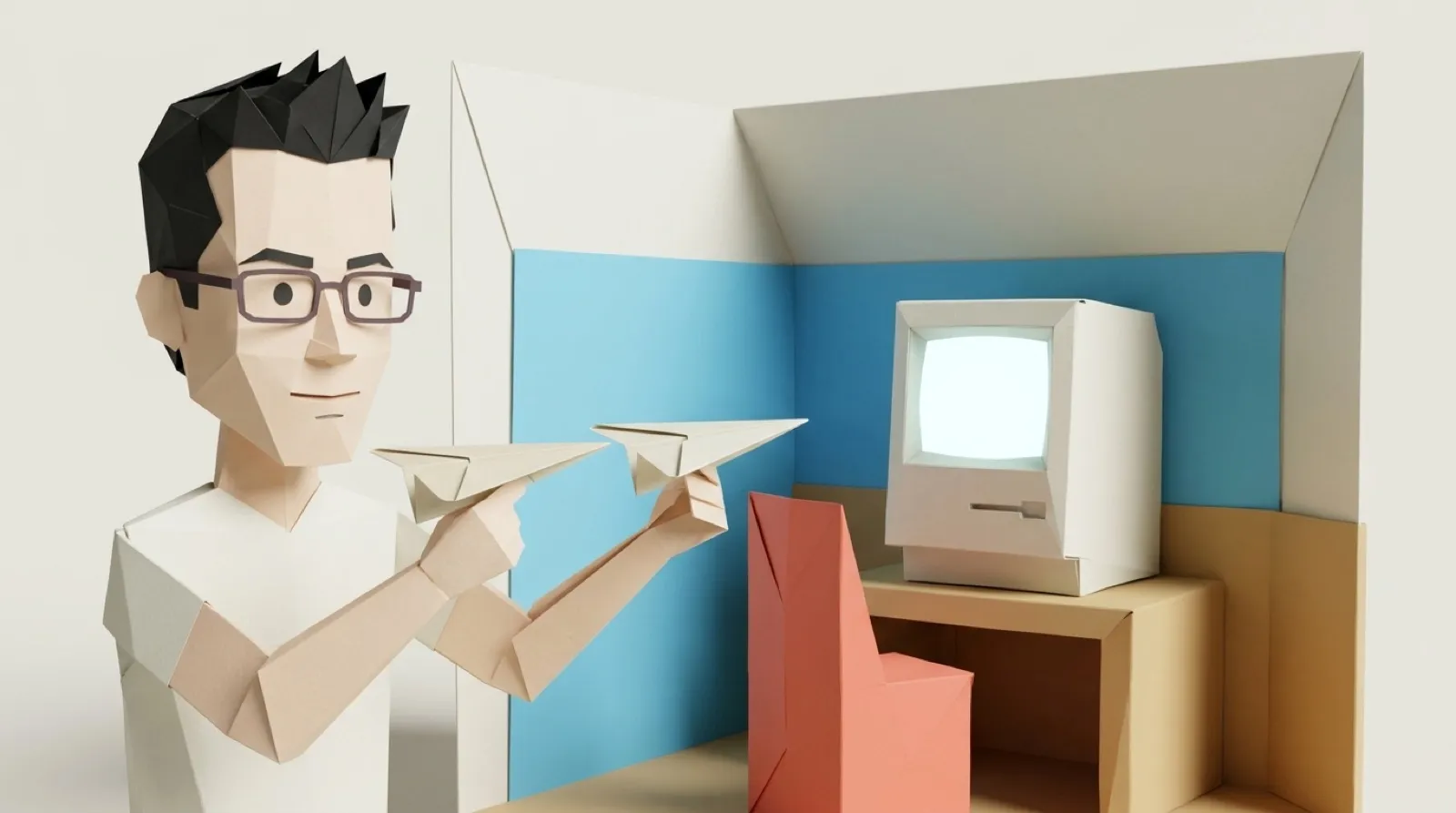 Chris Pirillo holding two identical paper airplanes side by side over a folded-paper room with an old compact computer, in an origami diorama.